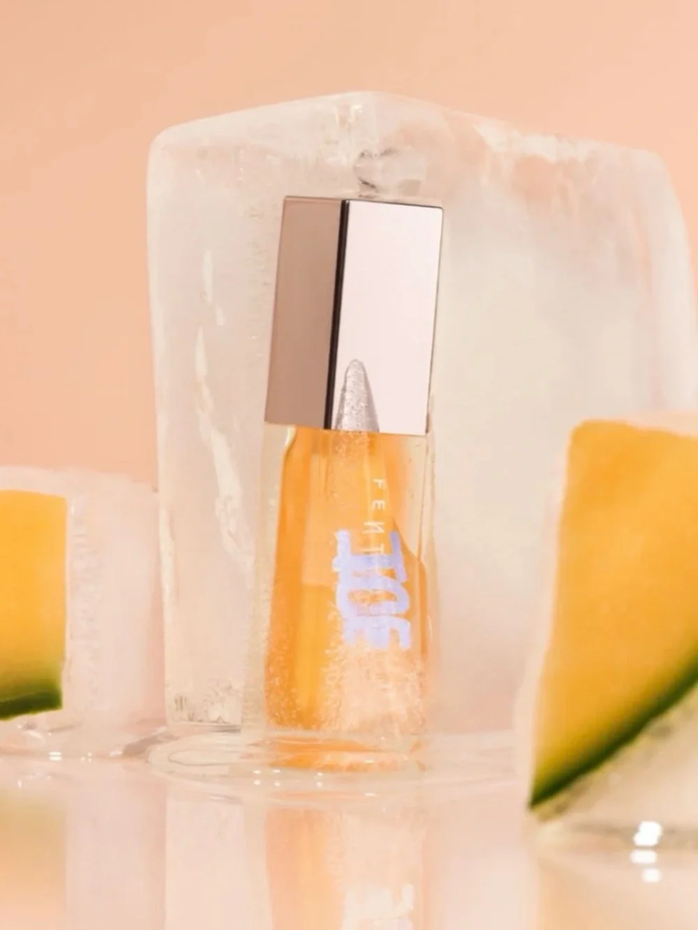 FENTY BEAUTY GLOSS BOMB ICE COOLING LIP LUMINIZER COLOR: MELON CHILLZ